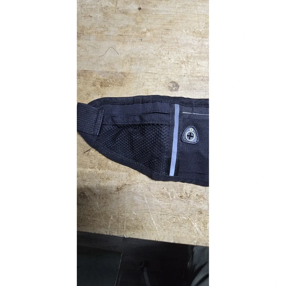 Xeasyr brand black running belt designed for carrying small essentials like phon